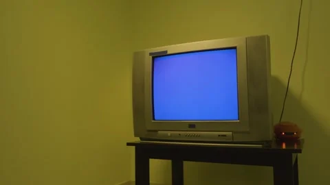 TV switches from side view to front view on a blue screen 4k short Vídeo Stock 252211584