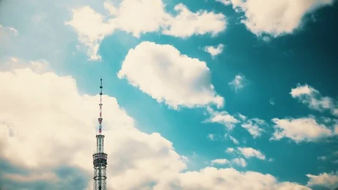 TV tower against the background of Running clouds. Time Lapse. Stock Footage 77119927