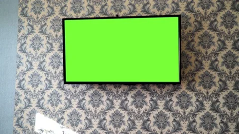 TV on the wall, chroma key, green screen, watching your favorite shows Stock Footage 165053624
