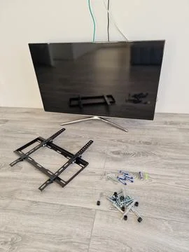 TV wall mount bracket mounting process Stock Photos