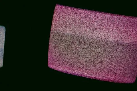 TVs with interference in dark rooms Stock Photos