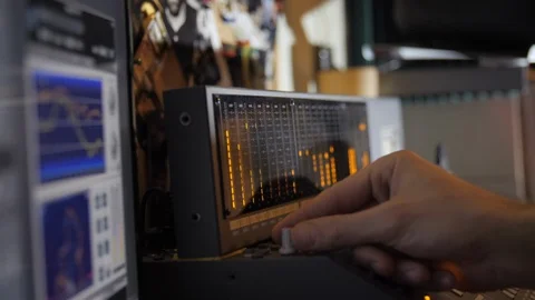 Tweaking knobs, audio mixing board, audio levels Stock Footage 90757065