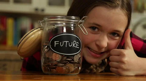 A tween girl saving for the future Stock Footage 44116884