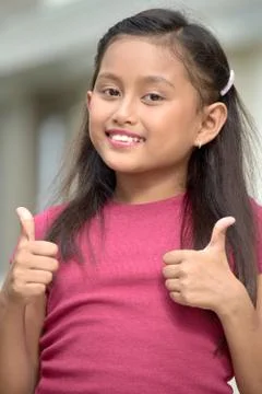 Tween With Thumbs Up Foto stock