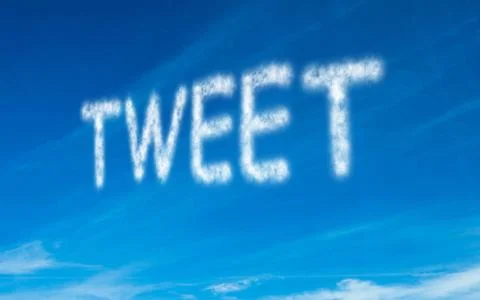 Tweet written in white in sky Stock Illustration