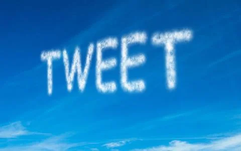 Tweet written in white in sky Ilustración de archivo