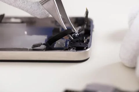 Tweezers Changing Broken Camera Of Mobile Phone Stock Photos