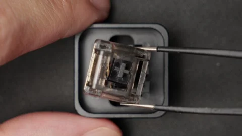 Tweezers Removing Components Of Broken Keyboard Switch, Close Up Top Down Stock Footage 270938463