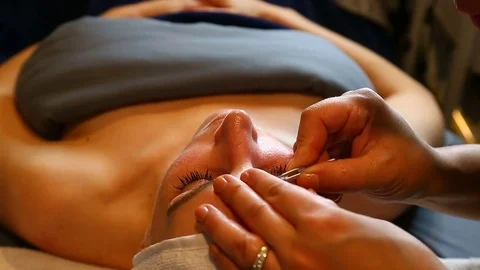 TWEEZING EYEBROWS Stock Footage 83495709