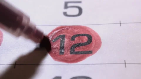 Twelfth number on calendar close-up is marked with bright red marker Video stock 220160465