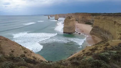 Twelve Apostles limestone rock stacks and blue sea coastline, Melbourne Stock Footage 337981342