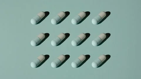 Twelve blue pills get bigger on a blue background. Stock Footage 168909734