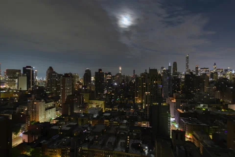 Twelve Hour Full Lunar Eclipse Cityscape (2 of 3) Stock Footage 194640173