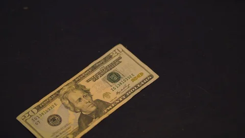 Twenty Dollar Bill Sliding on a Table Stock Footage 94159040