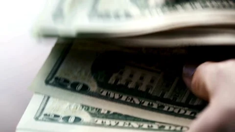 Twenty dollar bills being counted. Person hands Counting a Stack of 20 dollar US Stock-Footage 336264322