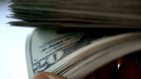 Twenty dollar bills being counted. Person hands Counting a Stack of 20 dollar US Stock-Footage 336264650