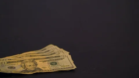 Twenty Dollar Bills Falling onto a Table Stock Footage 94158453