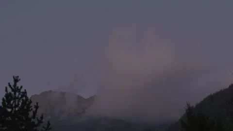 Twilight in the Alpine mountains. Moving clouds Stock Footage 273774173