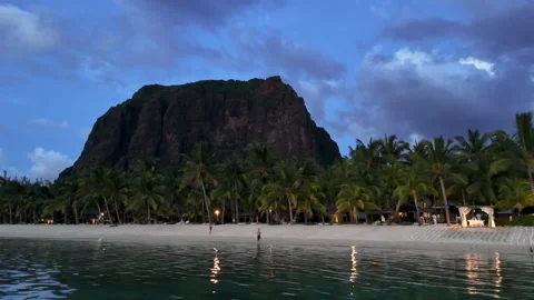 Twilight beach view with palm trees and Le Morne mountain Stock Footage 314507884