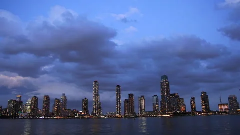 Twilight Cityscape with Cloudy Sky Over Urban Skyline Stock Footage 266159621