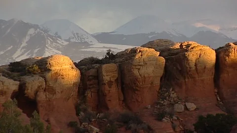 Twilight on Cliffs with Snowy Mountains Stock Footage 93790261