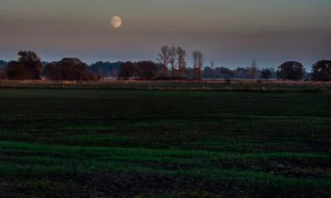 Twilight falling over fields Stock Photos