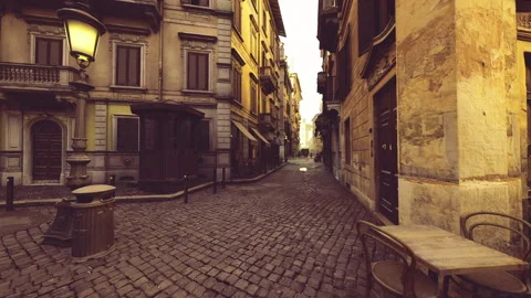 Twilight illumination emphasizing old building facades and shadow interplay Stock Footage 339616775