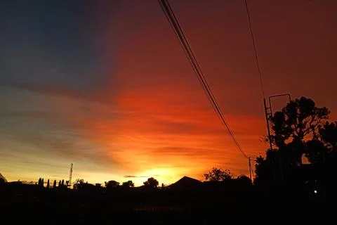 Twilight Light Splits the Sky. Stunning Blue and Orange Combination at Sunset Stock Photos