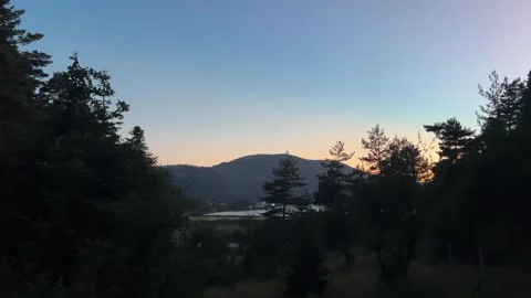 Twilight Over Abant Lake Framed by Pine Trees Stock Footage 345520327