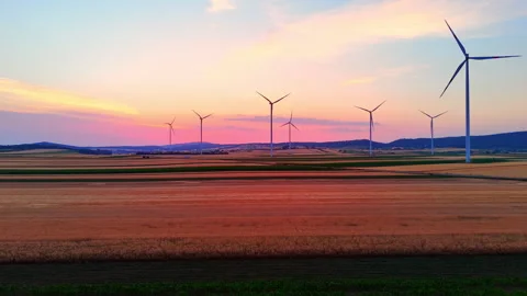 Twilight over agricultural fields and wind turbines, Austria Stock-Footage 344695627