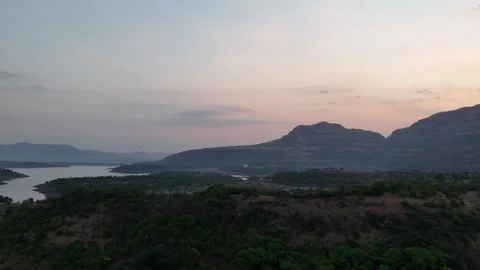 Twilight over Bhandardara backwaters and Sahyadri hills India Stockbeeldmateriaal 341128294