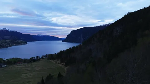 Twilight over Norwegian valley with distant snowy peaks 스톡 동영상 334152747