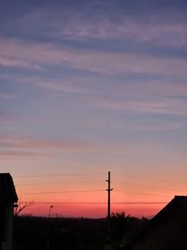 Twilight over the suburban rooftops Stock Photos