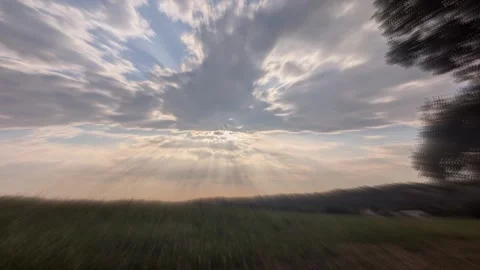 Twilight rays of the sun filter through the clouds Stock Footage 346825704