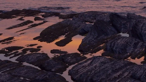 Twilight reflected in the sea between rocks Stock Footage 112295521