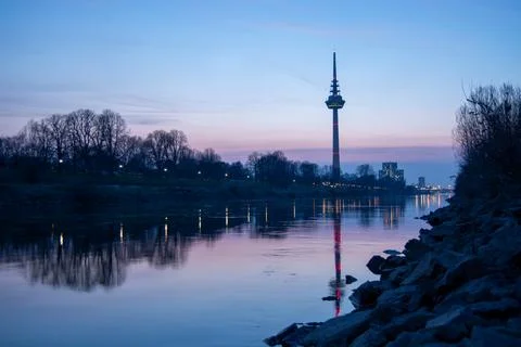 Twilight reflection of a tower in a river Stock Photos