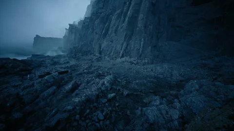 Twilight showcases sharp cliffs as thunderheads rush along shore Stock Footage 331523901