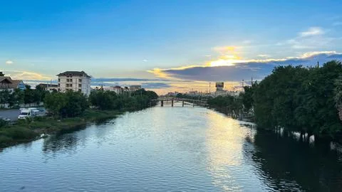 The twilight sky and clouds in sunset time above the canal. Stockfoto's