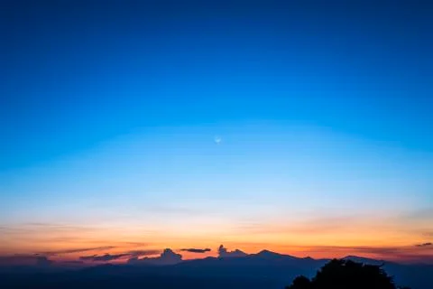 Twilight sky with the moon Stock Photos