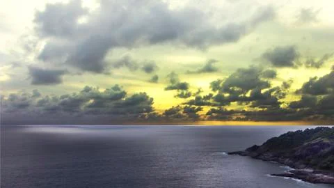 Twilight sky on the ocean with seashore Stock Photos