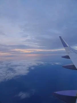 Twilight sky over the earth view from airplane Stock Photos