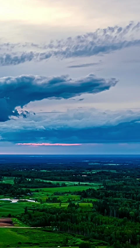 Twilight Storm Clouds Glow Pink Over Latvian Farmland Aerial Vídeos de archivo 345117959