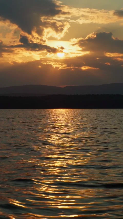 Twilight sunset on the lake. Cloudy sky, sunlight. Stock Footage 292600928