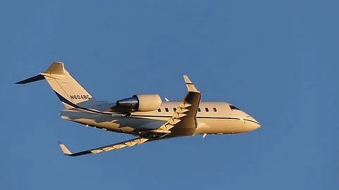 Twilight take off, private jet plane climbs skyward Stock Footage 69798759