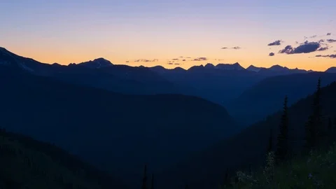 Twilight Time Lapse Over a Valley in Glacier National Park Stock Footage 121985551