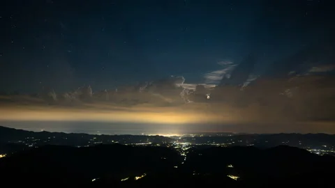 Twilight time lapse at sunset and stars appears in night sky - lightning Stock Footage 211686557