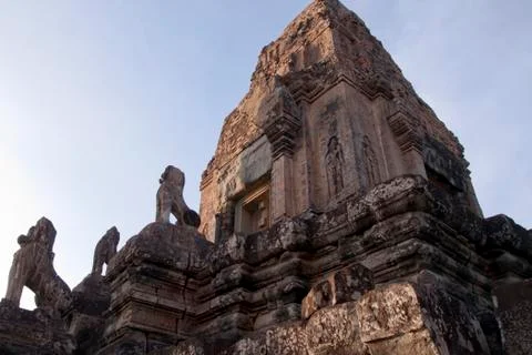 Twilight view of tower at  Pre Rup temple with stone animal statues on staircase Stock Photos