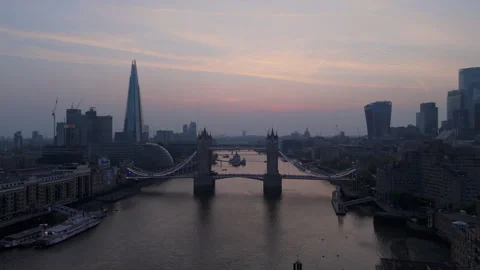 Twilight views of Tower Bridge and the London Skyline at dusk, showcasing Stock Footage 310477402
