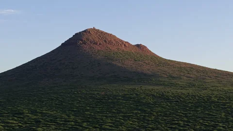 Twilight Volcanic Summit Red Rock Forward Pan Right 4K HLG Stock Footage 343802323