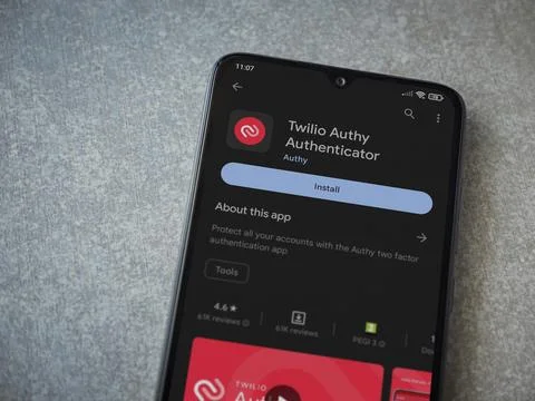 Twilio Authy Authenticator app play store page on smartphone on ceramic sto.. Foto stock